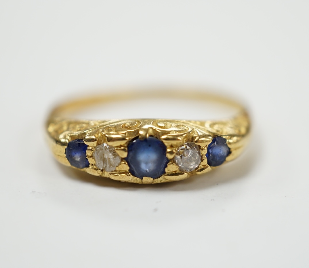 An 18ct three stone sapphire and two stone diamond set half hoop ring, size N, gross weight 3 grams. Poor condition.